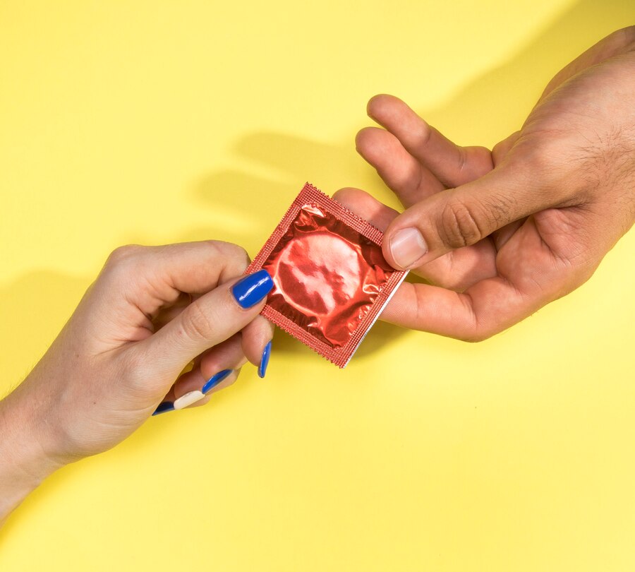 close up man woman holding condom_23 2148237883